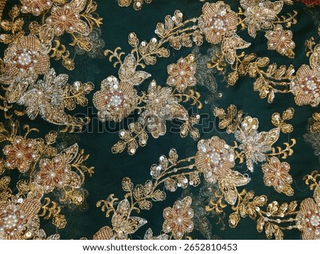 the image shows floral design pattern on a chiffon fabric with pearl, beads, crystal and sequins workwith zardozi techniques
for bridal and wedding dress shows the authentic South Asia textile work 
