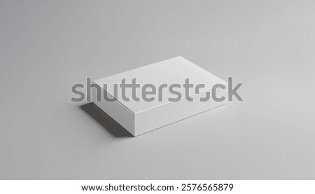 Image shows a plain white rectangular box sitting on a light grey background, creating a simple and minimalist scene.