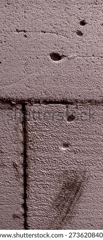 The image shows a rough-looking texture of hebel or porous concrete, perhaps part of an outdoor wall or structure.