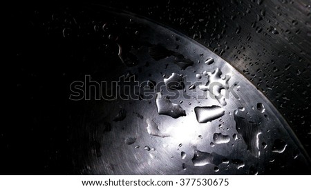 Image shows water droplets on stainless steel washbasin after hand wash. Stainless steel lasts longer than other material. It does not stain, corrode or rust easily. It is waterproof and hygienic. ストックフォト © 