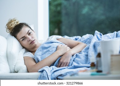 Image Of Sick Woman Lying In Bed
