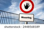 An image with a signpost pointing in two different directions in German. One direction points to success, the other points to failure.