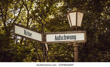 An image with a signpost pointing in two different directions in German. One direction points to upturn, the other points to crisis.