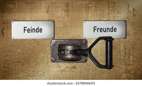 An image with a signpost pointing in two different directions in German. One direction points to friends, the other points to enemies.