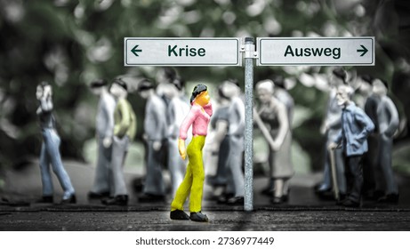 An image with a signpost pointing in two different directions in German. One direction points to a way out, the other points to a crisis.