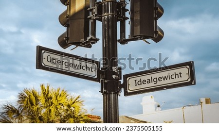 An image with a signpost pointing in two different directions in German. One direction points to me, the other points to you.