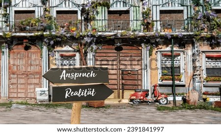 An image with a signpost pointing in two different directions in German. One direction points to reality, the other points to expectation
