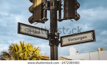 An image with a signpost pointing in two different directions in German. One direction points to precautions, the other points to worries.