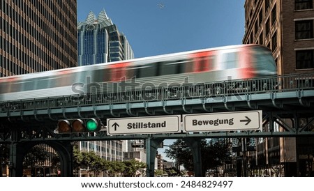 An image with a signpost pointing in two different directions in German. One direction points to movement, the other points to standstill.