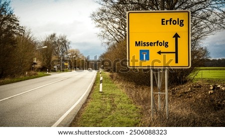 An image with a signpost pointing in two different directions in German. One direction points to success, the other points to failure.