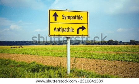 An image with a signpost pointing in two different directions in German. One direction points to sympathy, the other points to antipathy.