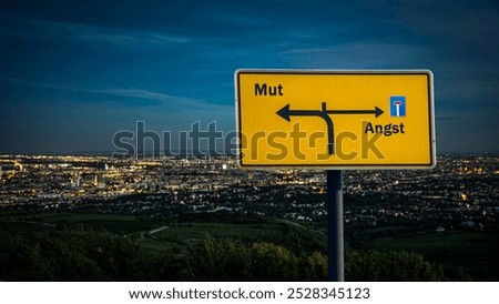 An image with a signpost pointing in two different directions in German. One direction points to courage, the other points to fear.