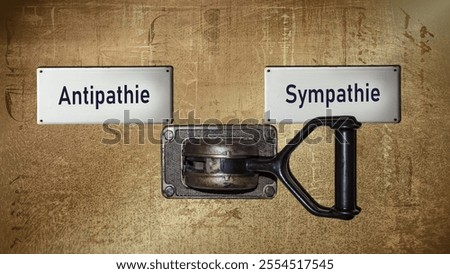 An image with a signpost pointing in two different directions in German. One direction points to sympathy, the other points to antipathy.
