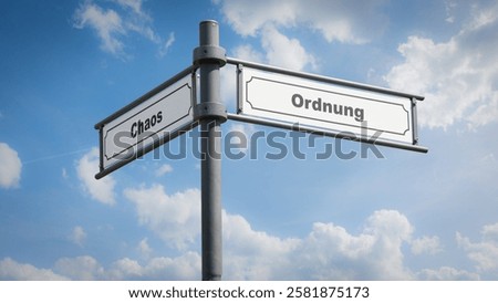 An image with a signpost pointing in two different directions in German. One direction points to order, the other points to chaos.