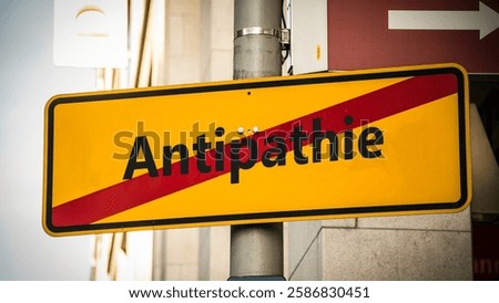 An image with a signpost pointing in two different directions in German. One direction points to sympathy, the other points to antipathy.