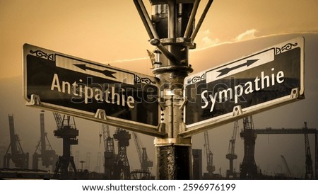 An image with a signpost pointing in two different directions in German. One direction points to sympathy, the other points to antipathy.