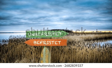An image with a signpost pointing in two different directions in German. One direction points to Perpetual, the other points to Temporary.