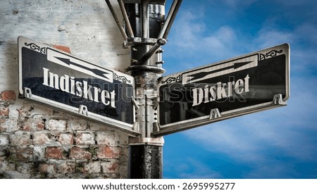 An image with a signpost pointing in two different directions in German. One direction points to Discreet, the other points to Indiscreet.