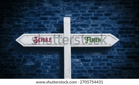 An image with a signpost pointing in two different directions in German. One direction points to holidays, the other points to school.