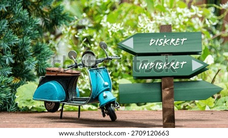 An image with a signpost pointing in two different directions in German. One direction points to Discreet, the other points to Indiscreet.