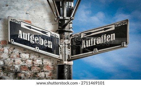 An image with a signpost pointing in two different directions in German. One direction points to picking up, the other pointing to giving up.