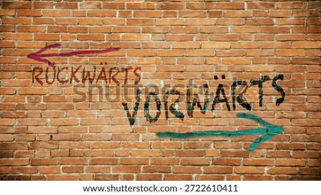 An image with a signpost pointing in two different directions in German. One direction is forward, the other is backward.