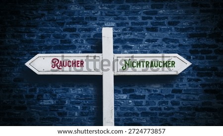 An image with a signpost pointing in two different directions in German. One direction points to non-smokers, the other points to smokers.