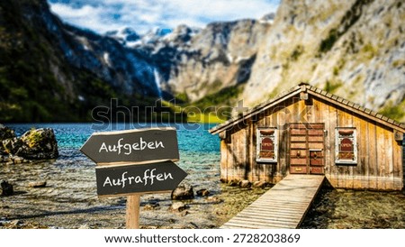 An image with a signpost pointing in two different directions in German. One direction points to picking up, the other pointing to giving up.