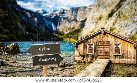 An image with a signpost pointing in two different directions in German. One direction points to a way out, the other points to a crisis.