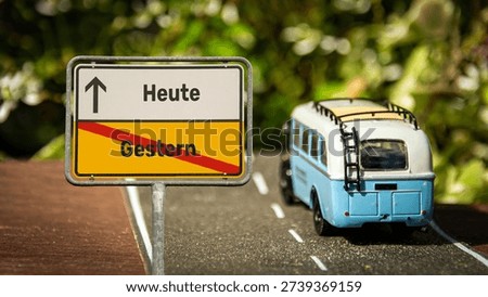 An image with a signpost pointing in two different directions in German. One direction points to today, the other points to yesterday.