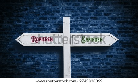 An image with a signpost pointing in two different directions in German. One direction is copying, the other is invention.