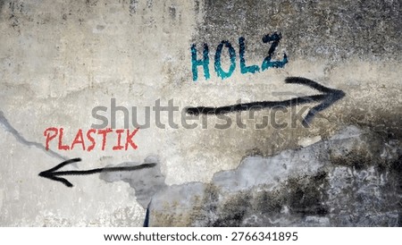 An image with a signpost pointing in two different directions in German. One direction points to wood, the other points to plastic.