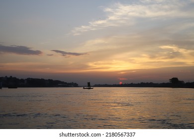 Image Of Silhouette, Rower At Sunset