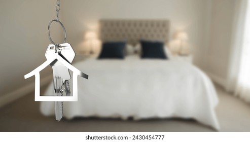 Image of silver house keys and house shaped key fob hanging over an out of focus bedroom 4k - Powered by Shutterstock