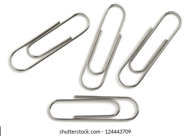 Image of silver paper clip isolated on white background - Shutterstock ID 124443709