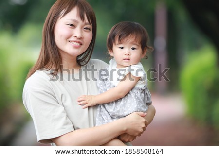 Image of smiling parents and children