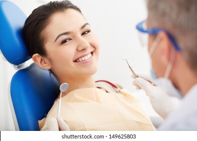 Image of smiling patient looking at camera at the dentistÃ?Â¢??s
