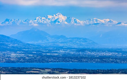 Image of snowcapped Mont Blanc Massif and Leman Lake seen from Jura Mountains in France.