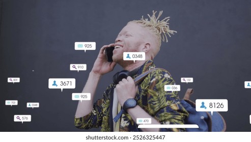 Image of social media data processing over albino man using smartphone in city. Global computing, digital interface and data processing concept digitally generated image. - Powered by Shutterstock