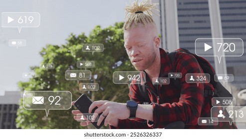 Image of social media data processing over albino man using smartphone in city. Global computing, digital interface and data processing concept digitally generated image. - Powered by Shutterstock