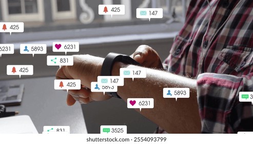 Image of social media icons with numbers over african american man using smartwatch. Global communication, social media, connections and digital interface concept digitally generated image. - Powered by Shutterstock