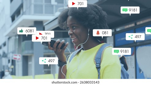 Image of social media icons with numbers over african american woman talking on smartphone. Social media and digital interface concept digitally generated image.