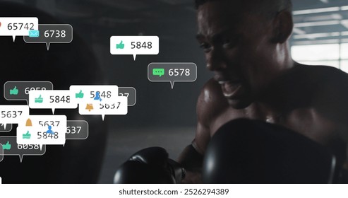 Image of social media icons over african american male boxer practicing punches at the gym. Social media networking and sports fitness concept - Powered by Shutterstock