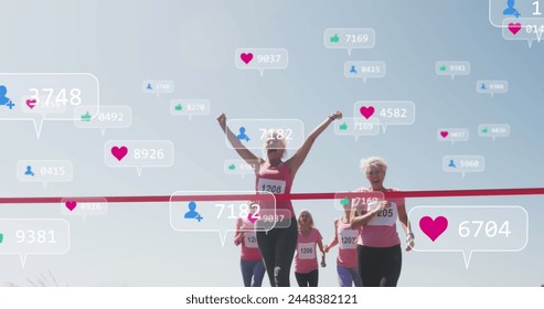 Image of social media notifications, over female runners finishing race. positive feelings and wellbeing social media concept, digitally generated image. - Powered by Shutterstock