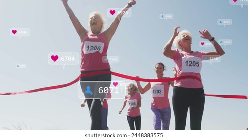 Image of social media notifications, over female runners finishing race. positive feelings and wellbeing social media concept, digitally generated image. - Powered by Shutterstock