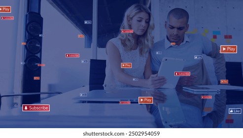 Image of social media notifications over diverse colleagues using tablet at casual office. Digital interface, social network, connection, business and communication, digitally generated image. - Powered by Shutterstock