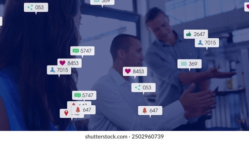 Image of social media notifications over caucasian colleagues talking at office. Digital interface, social network, connection, business and communication, digitally generated image. - Powered by Shutterstock