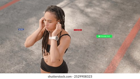 Image of social media notifications over biracial woman training outdoors. Fitness, healthy lifestyle, social network, digital interface, internet and communication, digitally generated image. - Powered by Shutterstock