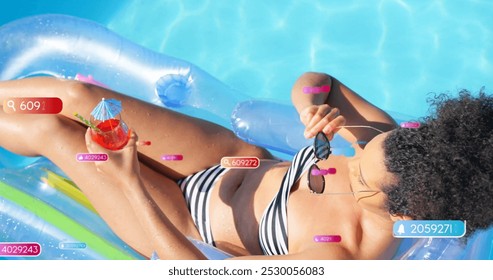 Image of social media notifications over biracial woman sunbathing in pool. Relaxation, vacations, social network, digital interface, internet and communication, digitally generated image. - Powered by Shutterstock