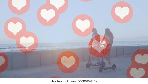 Image of social media red heart icons over couple on electric scooters by seaside. social media, communication and connection concept digitally generated image. - Powered by Shutterstock